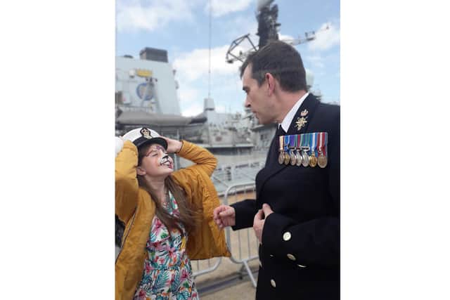 Erin Wiggins, 12, pictured with a beaming smile welcoming her dad Chief Petty Officer Paul Wiggins back to Portsmouth in August, 2019. The picture now features in the next national Little Troopers calendar