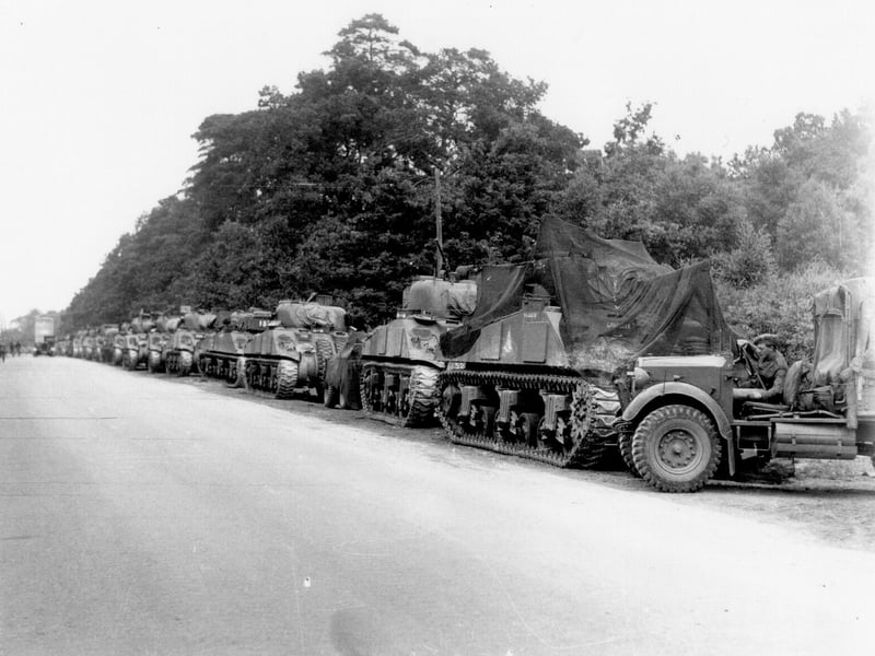 Vehicles (mostly British-crewed Sherman tanks) along a roadside, waiting to go to Normandy, probably in the Waterlooville area.