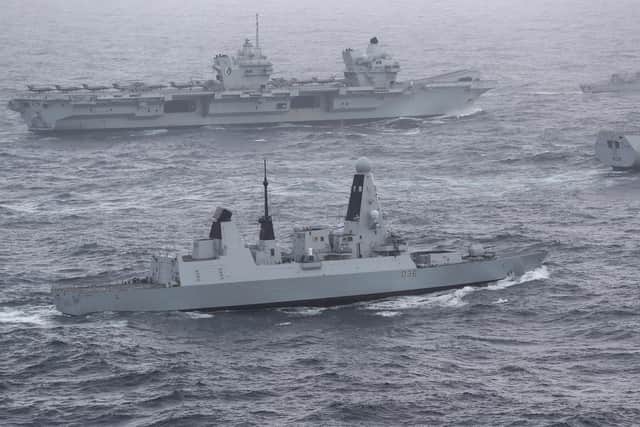 HMS Defender pictured next to HMS Queen Elizabeth.