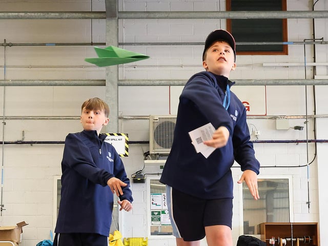 Year 7 pupils from Meoncross School learn test out their paper aeroplane designs at SULSTEMIC