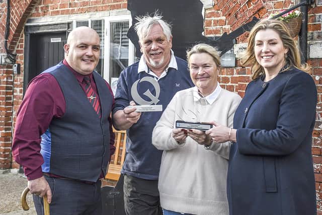 Penny Mordaunt MP presenting awards to local artisan producers David and Jayne from Yarty Cordials Ltd at Fort Cumberland with Gary Weaving, CEO, of Forgotten Veterans UK.

Picture: Bill Butcher