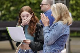 Annabel Bolton (left) receiving her GCSE results with her mother Helen at Portsmouth Grammar School, in Hampshire. Pic: Andrew Matthews/PA Wire