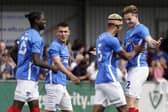 Liam Vincent, right, celebrates his pre-season friendly goal against the Hawks with Haji Mnoga, Alfie Bridgman and Jay Mingi