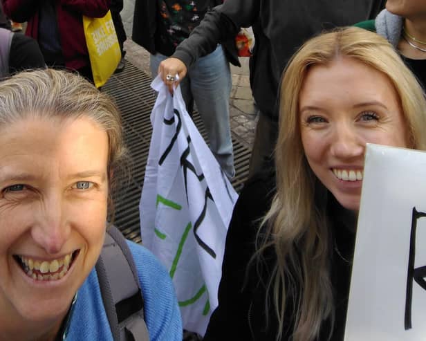 Clare Seek (left) at the Fixfest 2022 protest in Brussels, Belgium
