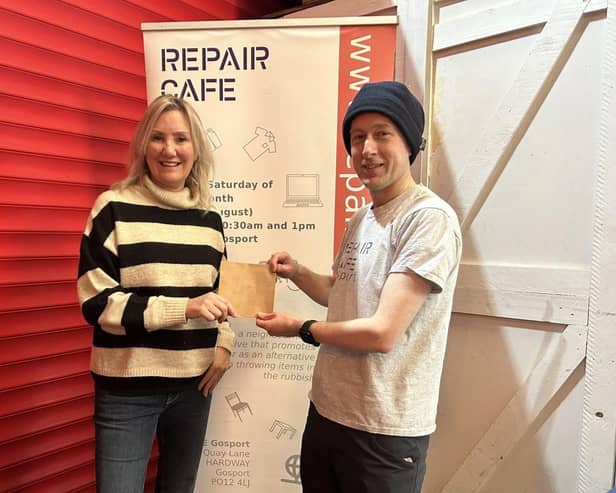 Gosport MP Caroline Dinenage gives a donation to Keith Brady, chair of Repair Cafe Gosport.