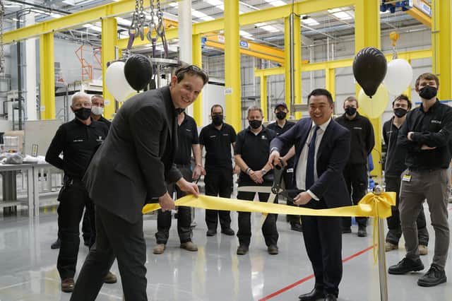 Left, Matt Bylett, head of operations at Sartorius Stedim Chromatography, with MP Alan Mak as he cuts the ribbon at the site. 