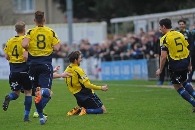 Dan Wooden (on knees) celebrates his wonder strike against Hawks at Privett Park on Boxing Day 2015. Picture Ian Hargreaves