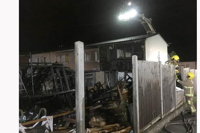 Firefighters surveying the fire damage in Bredenbury Crescent, Paulsgrove.  Picture: Mark Chapman