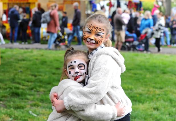 Sisters (l-r) Lily Saunders (4) and Daisy (7) at St Mary's Church in Fratton May Fayre. Picture: Sarah Standing (020522-5346)