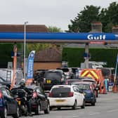 People queue for fuel at a petrol station. Picture: Joe Giddens/PA Wire
