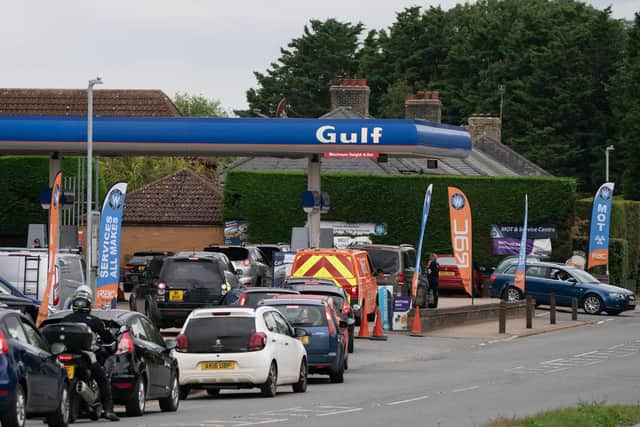 People queue for fuel at a petrol station. Picture: Joe Giddens/PA Wire