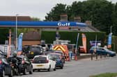 People queue for fuel at a petrol station. Picture: Joe Giddens/PA Wire