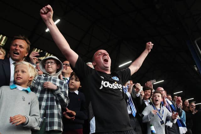 Paul Cook celebrates Pompey's League Two title success on the final day of the 2016-17 season.  Picture: Joe Pepler