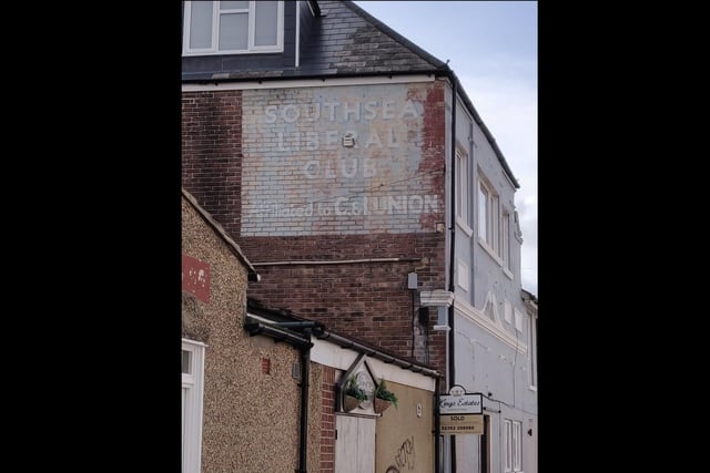 This faded sign at the north end of Duncan road reads: 'Southsea Liberal Club. Affiliated to C&I Union.'