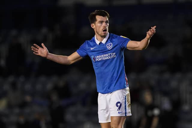 John Marquis looks towards the referee for a foul.