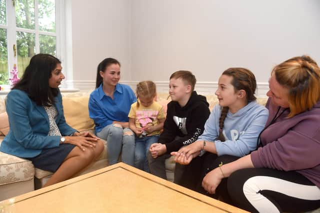 Ukranian refugees who are staying with a family in Sarisbury Green,

Pictured is: (l-r) Suella Braverman, MP for Fareham, talks to Yuliia Beresneva her children Anna (5) and Danylo (10) and Yevheniia Hlotova (9) with her mother Olha Sukhovii.

Picture: Sarah Standing (200522-7893)