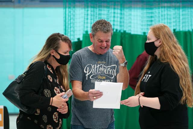 Hollie Kirby, right, with her parents Sarah and Matt Kirby as he celebrates his daughter's GCSE results.
Picture: Chris Moorhouse (jpns 120821-05)