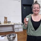 Jemma Corbin holding one of her candles at the workshop. Picture: Emily Turner