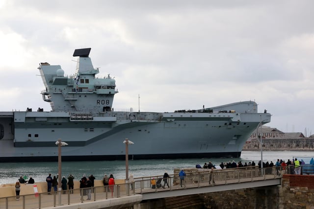 Delighted onlookers watch HMS Queen Elizabeth returning to Portsmouth Naval Base