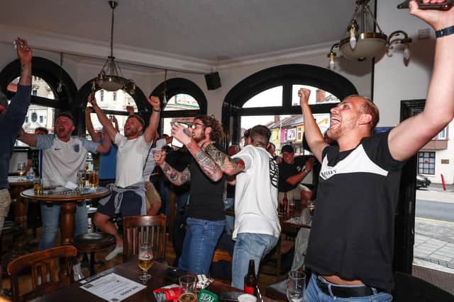 England fans watch England beat Germany 2-0 in the Euros 2020.Fans pictured in The Kings pub celebrating as England score their first goal.Picture: Stuart Martin (220421-7042)