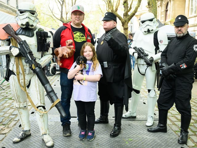 Pictured is: Isla Barnes with some Star Wars and Jurassic Park devotees. Picture: Keith Woodland (110521-12)