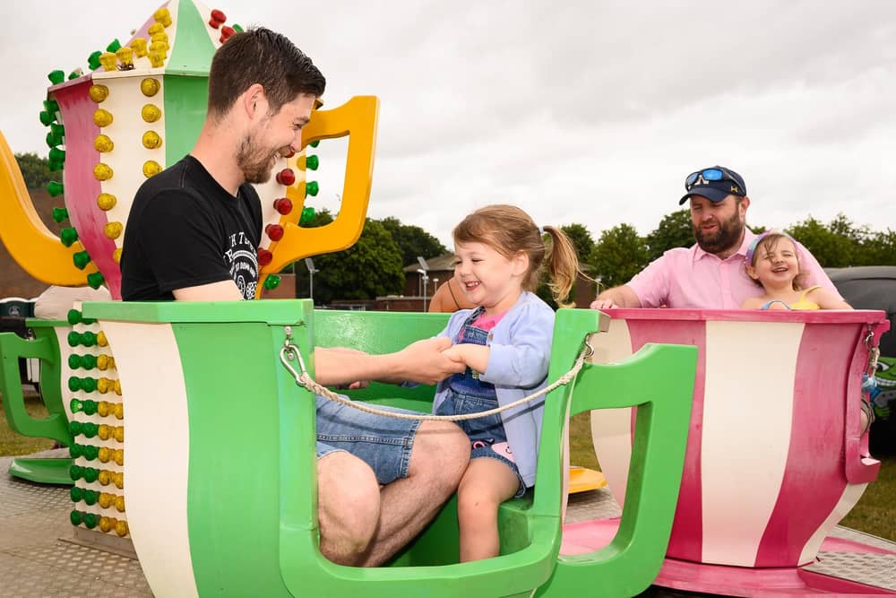 Phil and Eleanor Booth,4 enjoy a ride at HMS Collingwood's Open Day.