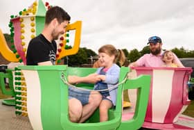 Phil and Eleanor Booth,4 enjoy a ride at HMS Collingwood's Open Day.
