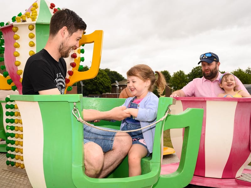 Phil and Eleanor Booth,4 enjoy a ride at HMS Collingwood's Open Day.
