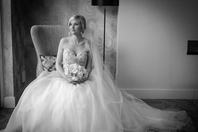 Sarah posing for photographs on her wedding day. Picture: Carla Mortimer Photography, carlamortimerweddingphotography.co.uk