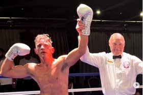 Liam Griffiths has his hand raised after claiming a points victory over Dale Arrowsmith in his comeback South Parade Pier bout