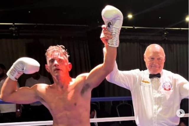 Liam Griffiths has his hand raised after claiming a points victory over Dale Arrowsmith in his comeback South Parade Pier bout