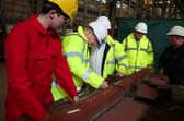 Prime Minister Boris Johnson marks a piece of metal, at the Cammel Laird shipyard in Merseyside. Picture date: Thursday March 10, 2022.  Photo by: Phil Noble/PA Wire