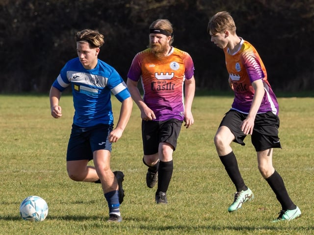 Bulldog (blue) v King George Rovers. Picture: Mike Cooter