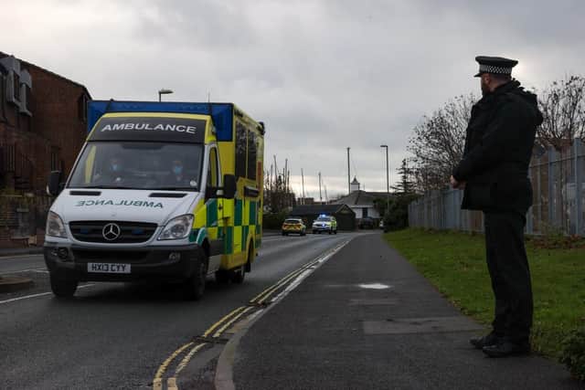 Police, paramedics and coastguard crews at Haslar Marina in Gosport on December 13, 2021. Picture: Alex Shute