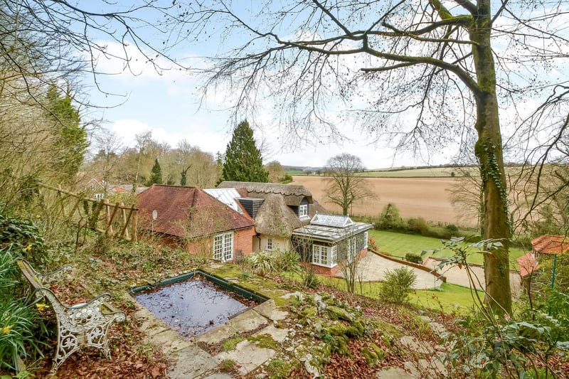 HIghbury Thatch in Hambledon is on the market for £1,895,000 with Fine and Country