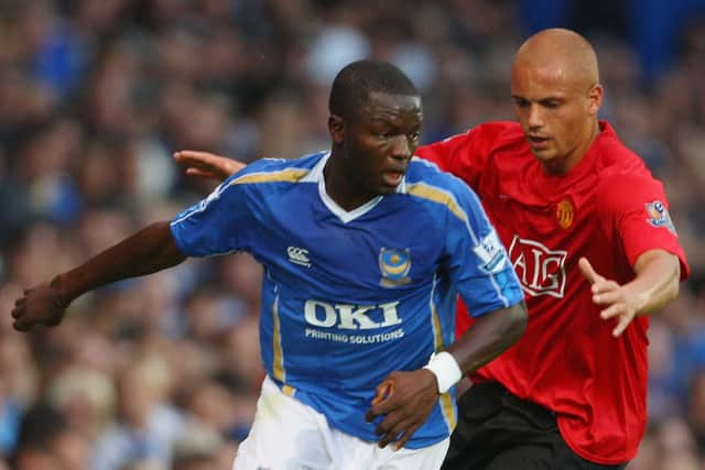 Manchester United's Wes Brown challenges Pompey's Sulley Muntari in a Premier League encounter in August 2017. Picture: Mike Hewitt/Getty Images.