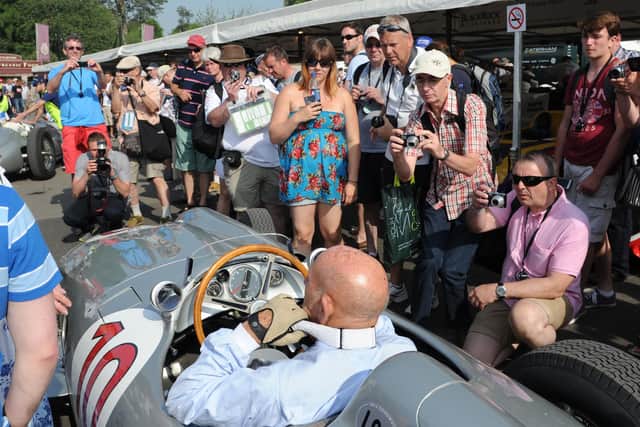 Always the centre of attention - Sir Stirling Moss at the Goodwood Festival of Speed 2013. Picture: Paul Jacobs