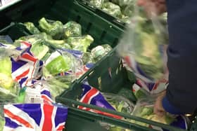 A Green Box Lifter checking for fresher food or longer dates.