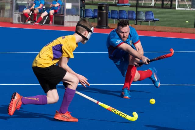 Tim Mallet, blue, in action for US Portsmouth in 2019/20 against Winchester. Picture: Duncan Shepherd