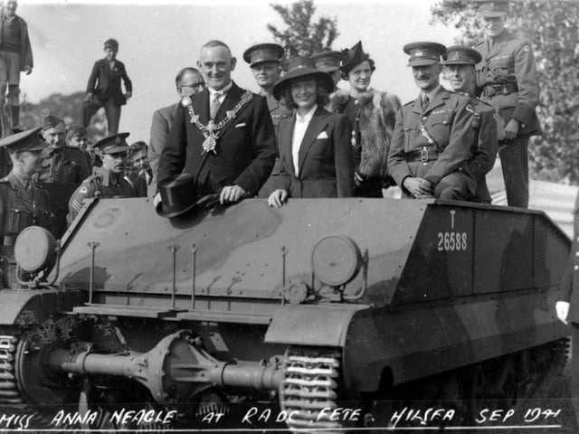 The young lady surrounded by officers and the mayor is actress Anna Neagle. She was attending a fete at the R.A.O.C. Barracks at Hilsea in September 1941.
Miss Neagle was the star of many films more well known as Queen Victoria in Victoria the Great 1937 and Sixty Glorious Years 1938. She also appeared as Nurse Edith Cavel, 1939.
Dame Anna Neagle at the R.A.O.C. Barracks in September 1941.
