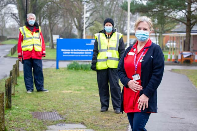 Vaccination lead, Stephanie Clark with fellow volunteers, Nick Leaver and Linda Swinburne, outside St James's Hospital, Portsmouth. Picture: Habibur Rahman