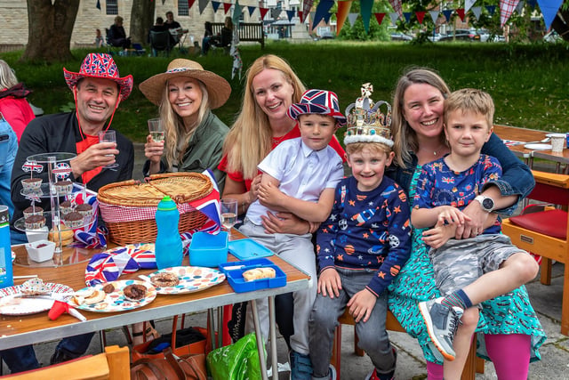 Outdoor fun at the Portsmouth Cathedral jubilee street party. Pictured: Adam Knight (48), Lisa Houghton (46), Kathy Knight (47), Harvey Knight (6), Louis Houghton-Taylor (wearing a crown to selebrate his sixth birthday), Yvonne Wiggins (45) and Benedict Williams (6). Picture: Mike Cooter (050622)