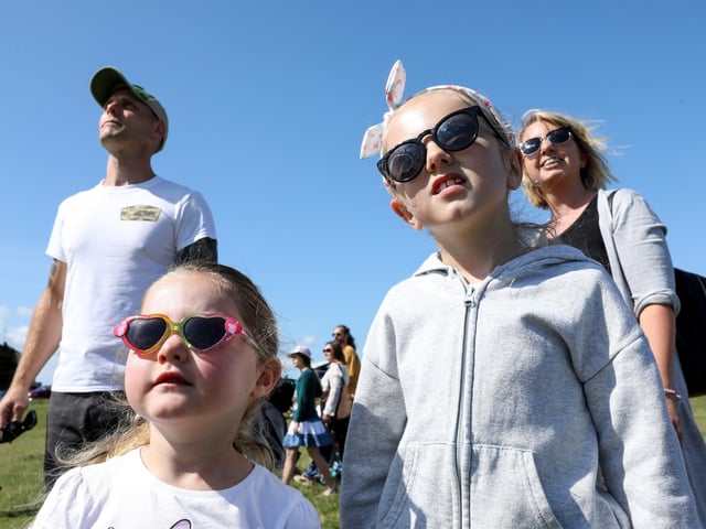 Mollie, 4, front left, and Poppy, 8, with their parents, Ben and Claire Campbell, at the Portsmouth International Kite Festival, Southsea Common.Picture: Chris  Moorhouse (270724-12)