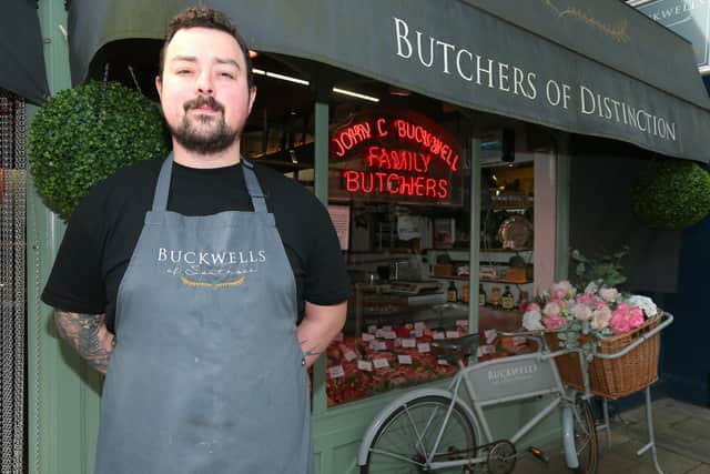Butcher Tom Bridle with the window display. Buckwells of Southsea, Osborne Road, Southsea.
Picture: Chris Moorhouse