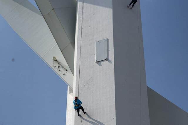 Penelope abseiling down the tower
