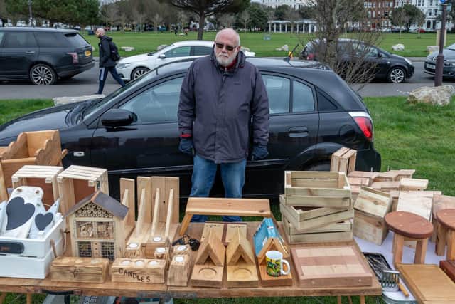 Brian Callard with his bee hotels, bird boxes and other craft creations made from recycled palettes and scrap materials. Picture: Mike Cooter (020423)