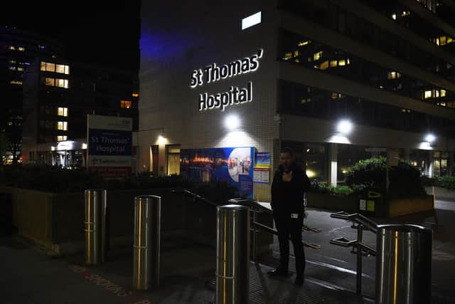 A security worker outside St Thomas' Hospital in Central London after Prime Minister Boris Johnson was admitted to hospital for tests as his coronavirus symptoms persist. Photo credit should read: Kirsty O'Connor/PA Wire