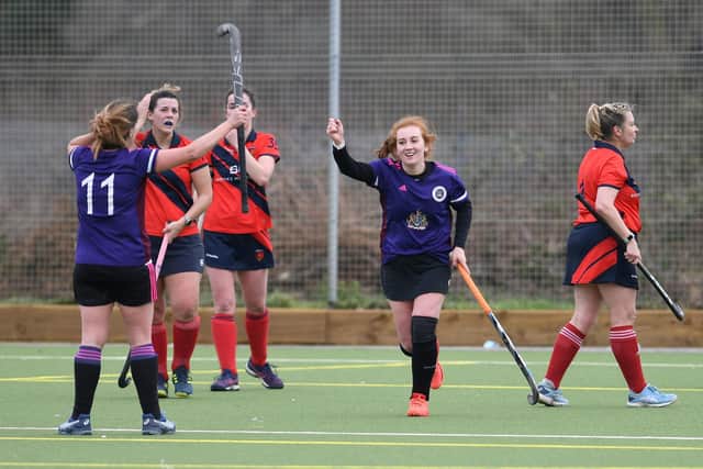 Portsmouth Ladies 2nds' Jess Richardson celebrates her second goal against Trojans 4ths. Picture: Neil Marshall