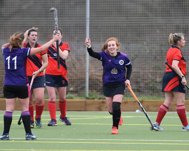 Portsmouth Ladies 2nds' Jess Richardson celebrates her second goal against Trojans 4ths. Picture: Neil Marshall
