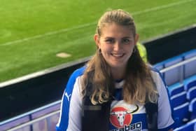 Russell's ashes are buried in the home goal at Reading Football Stadium. This photo was taken on game day, the first time Emily ever wore a football shirt.